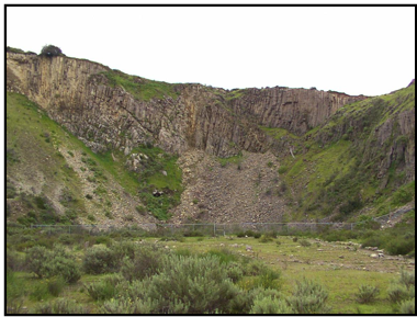 This is a series of 3 pictures that show a feature called columnar jointing. This is a a distance.