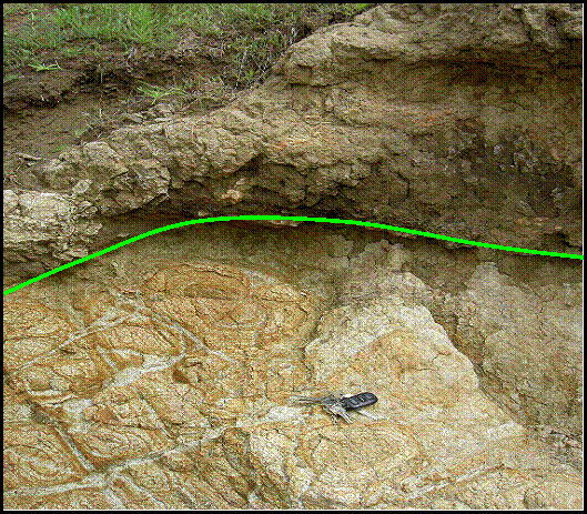 This is the first of two pictures showing the gray fine grained unit as a flow over the top of the tan coarse grained unit.This is closer.